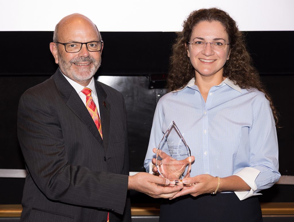 Nataliya Althukova receives a plaque commemorating her award from Dean Sam Easterling at the 2022 College of Engineering Honors and Awards Ceremony.