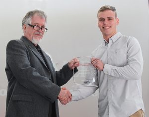 Andrew Szewc receives plaque