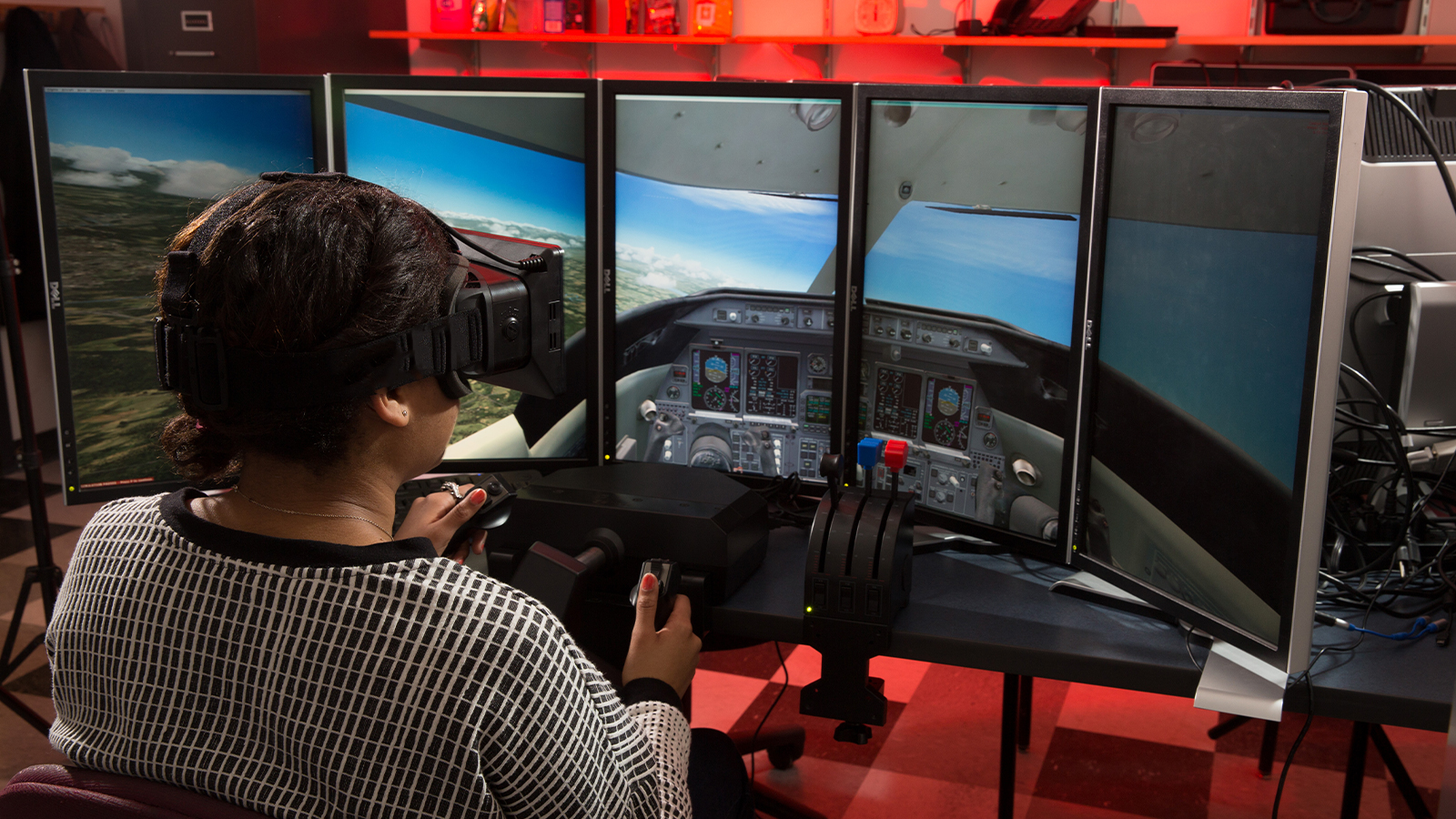 Student using VR flight simulator